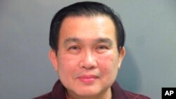 FILE - This undated photo provided by the Washington County (Ark.) Detention Center shows Simon S. Ang.