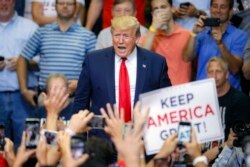 President Donald Trump arrives at a campaign rally at U.S. Bank Arena, Aug. 1, 2019, in Cincinnati.