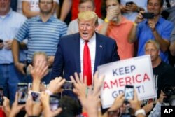 President Donald Trump arrives at a campaign rally at U.S. Bank Arena, Aug. 1, 2019, in Cincinnati.