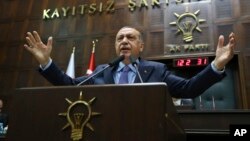 Turkey's President Recep Tayyip Erdogan gestures as he deliver a speech to members of his ruling Justice and Development Party (AKP), during its weekly meeting in Ankara, Turkey, May 8, 2018.