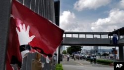 Poster yang sobek terlihat masih menempel di luar gedung Dewan Legislatif di Hong Kong, Jumat, 5 Juli 2019.