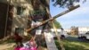 A makeshift memorial was left near the site where unarmed African American teenager Michael Brown was recently shot to death by a white police officer in Ferguson, Missouri. (Gesell Tobias, VOA)