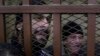 Some of 26 men, who were arrested in a televised raid last month by police looking for gays at a Cairo public bathhouse, react after an Egyptian court acquitted them in Cairo, Jan. 12, 2015.