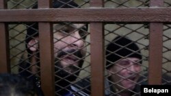 Some of 26 men, who were arrested in a televised raid last month by police looking for gays at a Cairo public bathhouse, react after an Egyptian court acquitted them in Cairo, Jan. 12, 2015.