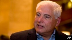 FILE - Panama's former President Ricardo Martinelli answers questions during an interview at a hotel in Guatemala City, Jan. 28, 2015. 