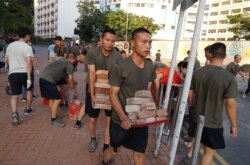 Personnel from the Chinese People's Liberation Army barracks in Hong Kong emerged on to the city streets on Nov. 16, 2019, to help with the cleanup after a week of violence and disruption caused by pro-democracy protesters.