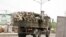 FILE - Soldiers are seen on a truck along a road in Maiduguri in Borno State, Nigeria.