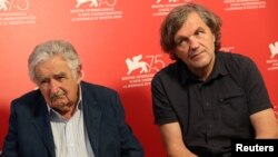 Director Emir Kusturica and former Uruguayan president Jose Mujica, left, are interviewed by Reuters at the 75th Venice International Film Festival, Venice, Italy, Sept. 3, 2018.