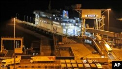 Lorries disembark the first ferry that arrived after the end of the transition period with the EU at the port in Dover, Jan. 1, 2021. 