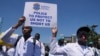 FILE—Doctors and other medical staff take part in a protest, in downtown Nairobi, Kenya, March 22, 2024. 