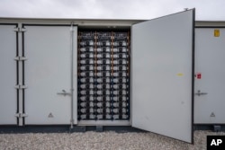 FILE - This photo shows part of a battery energy storage facility in Saginaw, Texas, April 25, 2023, that is owned and operated by Eolian L.P. . (AP Photo/Sam Hodde, File)