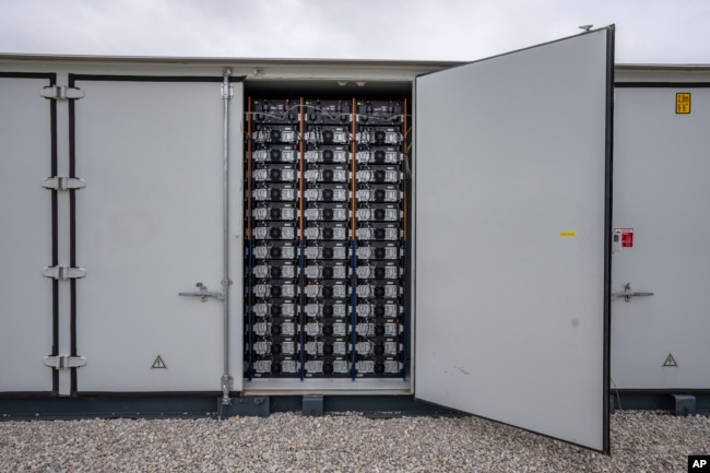 FILE - This photo shows part of a battery energy storage facility in Saginaw, Texas, April 25, 2023, that is owned and operated by Eolian L.P. . (AP Photo/Sam Hodde, File)