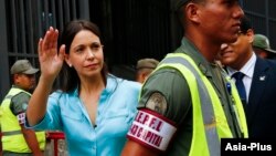 Venezuela's opposition leader Maria Corina Machado arrives at state prosecutor office in Caracas, Dec. 3, 2014.