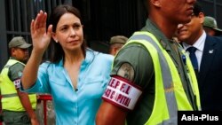 FILE - Venezuela's opposition leader Maria Corina Machado arrives at the state prosecutor's office in Caracas, Dec. 3, 2014.