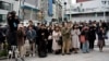 Bystanders pray at 2:46 p.m., March 11, 2025, in Tokyo, as Japan marked the 14th anniversary of the 2011 earthquake, tsunami, and nuclear disaster that devastated the northeastern coast. 