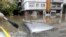 Submerged cars in a flooded street after a rainstorm in La Plata, Argentina, April 2, 2013. 