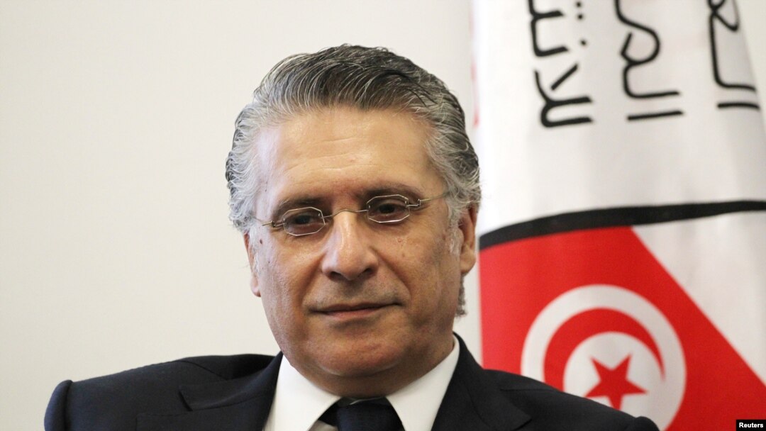 In this file picture taken on Aug. 2, 2019, Nabil Karoui, Tunisian media magnate and would-be presidential candidate submits his candidacy to Tunisia's electoral commission in the capital Tunis. 