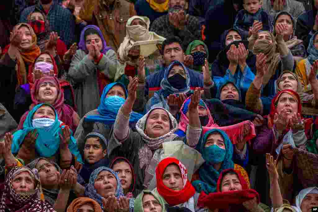 Kashmiri Muslim women pray as the head priest displays a relic at the Hazratbal shrine on the occasion of Mehraj-u-Alam, believed to mark the ascension of Prophet Muhammad to heaven, in Srinagar, Indian-controlled Kashmir.