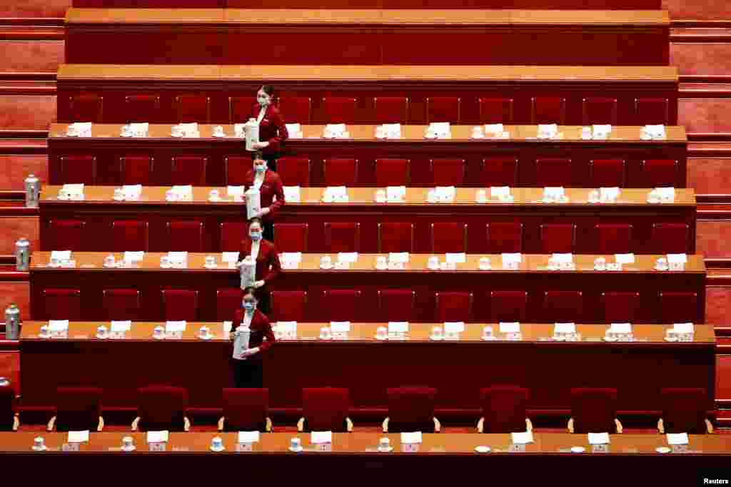 Attendants wearing face masks are seen before the second plenary session of the National People's Congress at the Great Hall of the People in Beijing, China.