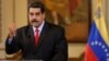 Venezuela's President Nicolas Maduro gestures as he talks to the media during a news conference in Caracas, Venezuela, Feb. 15, 2018.