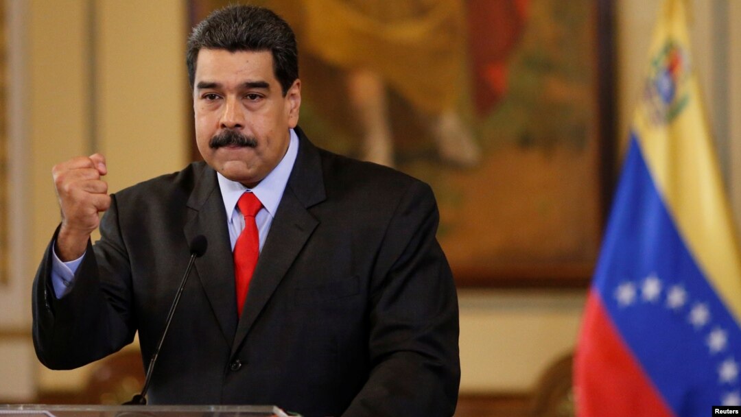 Venezuela's President Nicolas Maduro gestures as he talks to the media during a news conference in Caracas, Venezuela, Feb. 15, 2018.