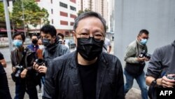 Hong Kong law professor and pro-democracy activist Benny Tai arrives at Ma On Shan police station in Hong Kong on Feb. 28, 2021, where he and other dissidents were charged under the city's new national security law.