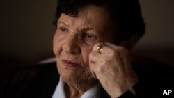 In this Jan. 23, 2019 photo, Holocaust survivor Cipora Feivlovich gives an interview to The Associated Press at her house in Jerusalem.