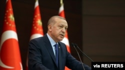 Turkish President Recep Tayyip Erdogan talks during a news conference following a coronavirus disease (COVID-19) meeting in Ankara, March 18, 2020.
