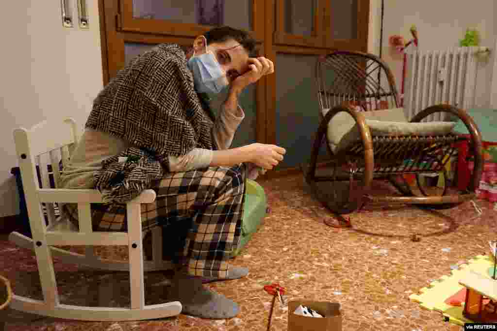 Italian doctor Cecilia Bartalena, 35, rests in her daughter&#39;s bedroom as she returns home from a long shift in the emergency ward at the Cisanello hospital, in this picture taken by her husband, musician Lorenzo Marianelli, in Pisa, Italy.