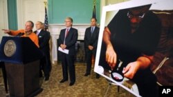 New York Mayor Michael Bloomberg announced the arrest of Jose Pimentel, pictured at right, who is accused of plotting to bomb police and post offices in New York City, Sunday, Nov. 20, 2011.