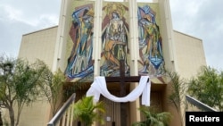 The front doors to a Catholic church are chained off on Easter Sunday, in Long Beach, California, during the outbreak of the coronavirus, April 12, 2020.