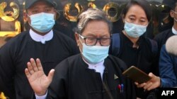 Khin Maung Zaw (C), a lawyer representing detained Myanmar civilian leader Aung San Suu Kyi and ousted president Win Myint, is pictured outside Zabuthiri Township Court in Naypyidaw on February 16, 2021. (Photo by STR / AFP)