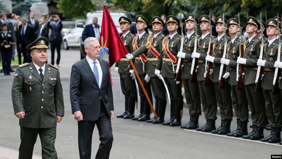 U.S. Secretary of Defense James Mattis and Ukraine's Defense Minister Stepan Poltorak walk past honor guards during a welcoming ceremony in Kyiv, Ukraine, Aug. 24, 2017.