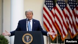 U.S. President Donald Trump take part in the daily coronavirus task force briefing in the Rose Garden at the White House in Washington, April 15, 2020. 