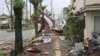 Puing-puing dan benda-benda yang tertiup angin kencang akibat Topan Shanshan terlihat di trotoar jalan di Miyazaki, Jepang barat daya, 29 Agustus 2024, sebagai ilustrasi. (Kyodo/via REUTERS)