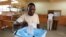 FILE: A man casts his ballot at a voting station in Kicolo, Luanda, Angola. Taken 8.31.2012