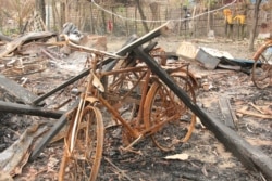 FILE - Burned Rohingya houses are seen in Ka Nyin Tan village of Maungdaw, northern Rakhine state of western Myanmar, Sept. 6, 2017.