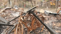 FILE - Burned Rohingya houses are seen in Ka Nyin Tan village of Maungdaw, northern Rakhine state of western Myanmar, Sept. 6, 2017.