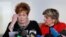 Beverly Young Nelson, left, reacts as she reads a statement to reporters with attorney Gloria Allred during a news conference announcing new allegations of sexual misconduct against Alabama Republican congressional candidate Roy Moore, in New York, Nov. 13, 2017.