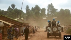 Des soldats marocains de la Monusco patrouillent dans le territoire de Djugu ravagé par la violence, dans la province de l'Ituri, dans l'est de la République démocratique du Congo, le 13 mars 2019.