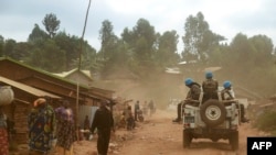 FILE - Moroccan soldiers from the U.N. mission in DRC (Monusco) patrol in the violence-torn Djugu territory, Ituri province, eastern Democratic Republic of Congo, March 13, 2019.