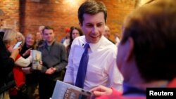 Democratic 2020 U.S. presidential candidate Pete Buttigieg greets voters during a campaign stop at Portsmouth Gas Light, in Portsmouth, New Hampshire, March 8, 2019.