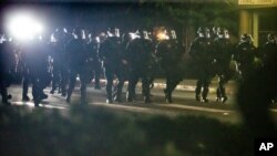 Police respond to demonstrators gathered at Floyd Light City Park, Aug. 6, 2020 in Portland, Ore.