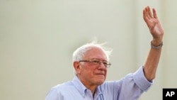 FILE - Democratic presidential candidate Sen. Bernie Sanders, I-Vt., waves to supporters as he arrives at a rally at Santa Monica High School Memorial Greek Amphitheater in Santa Monica, Calif., July 26, 2019. 