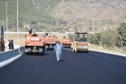 FILE - Road construction is underway as part of China's "Belt and Road" Initiative, in Haripur, Pakistan, Dec. 22, 2017.