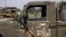FILE - A rocket propelled launcher hangs on the mirror of a pickup truck in the Nigerian city of Damasak March 18, 2015.