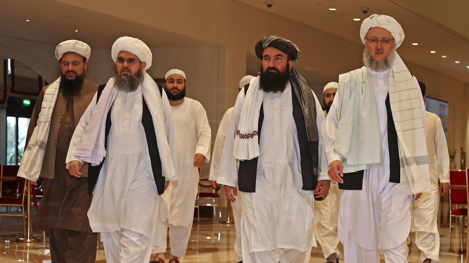 FILE - Taliban officials walk down a hotel lobby during talks in Doha, Qatar, Aug. 12, 2021. UN Secretary-General António Guterres will convene a meeting of various countries’ special representatives for Afghanistan in Qatar on February 18, 2024. 