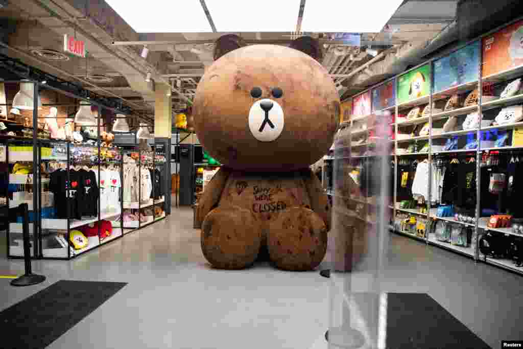 An empty store is seen near Times Square following the outbreak of the coronavirus in New York City, March 18, 2020.