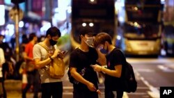 Protesters wear masks on the streets of Hong Kong, Oct. 4, 2019. 