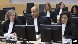 Representatives of the Office of the Prosecutor at the start of a two-day ICC hearing on where to try the eldest son of former Libyan dictator Moammar Gadhafi, The Hague, Oct. 9, 2012.